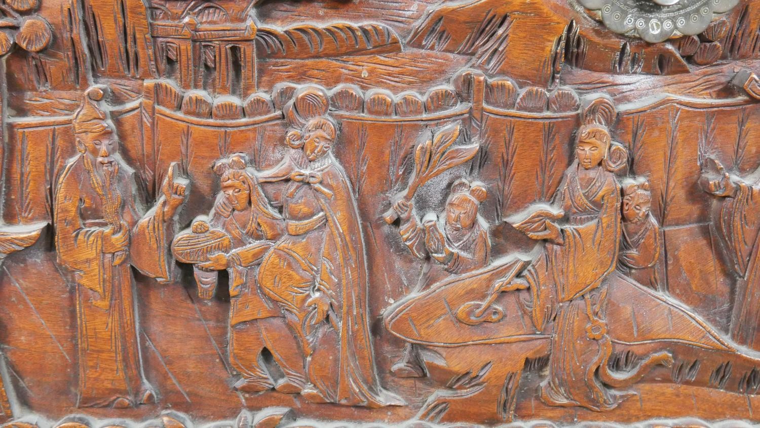 A 20th century Chinese camphorwood coffer, of rectangular form, the lid and sides ornately carved - Image 5 of 9