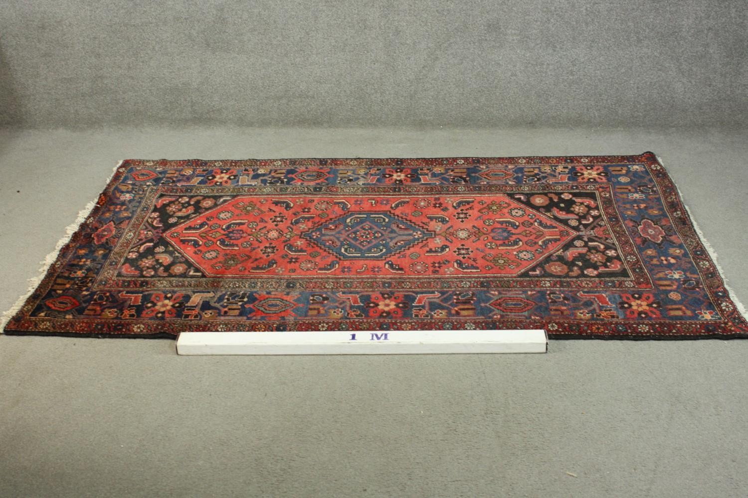 A hand made red ground Persian Hamadan carpet. L.210 W.129cm. - Image 2 of 5