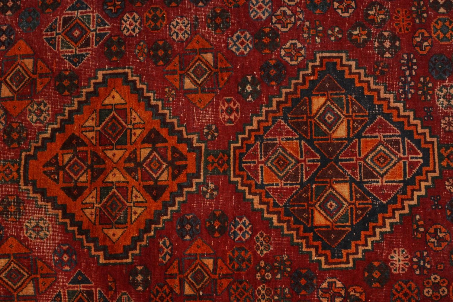 A hand made red ground Persian Qashqai carpet. L.236 W.155cm. - Image 3 of 6