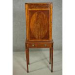A late 19th century Sheraton style mahogany and satinwood music cabinet, with oval inlay to the
