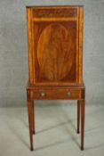 A late 19th century Sheraton style mahogany and satinwood music cabinet, with oval inlay to the