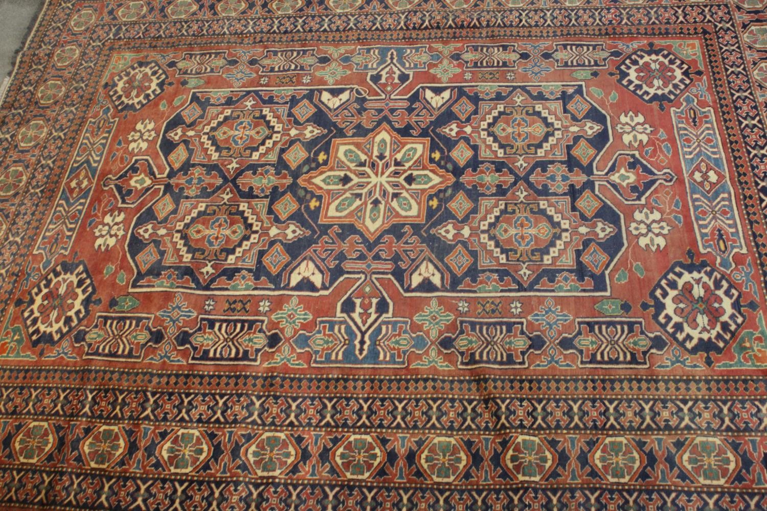 A hand made blue ground Chechen carpet. L.266 W.220cm.