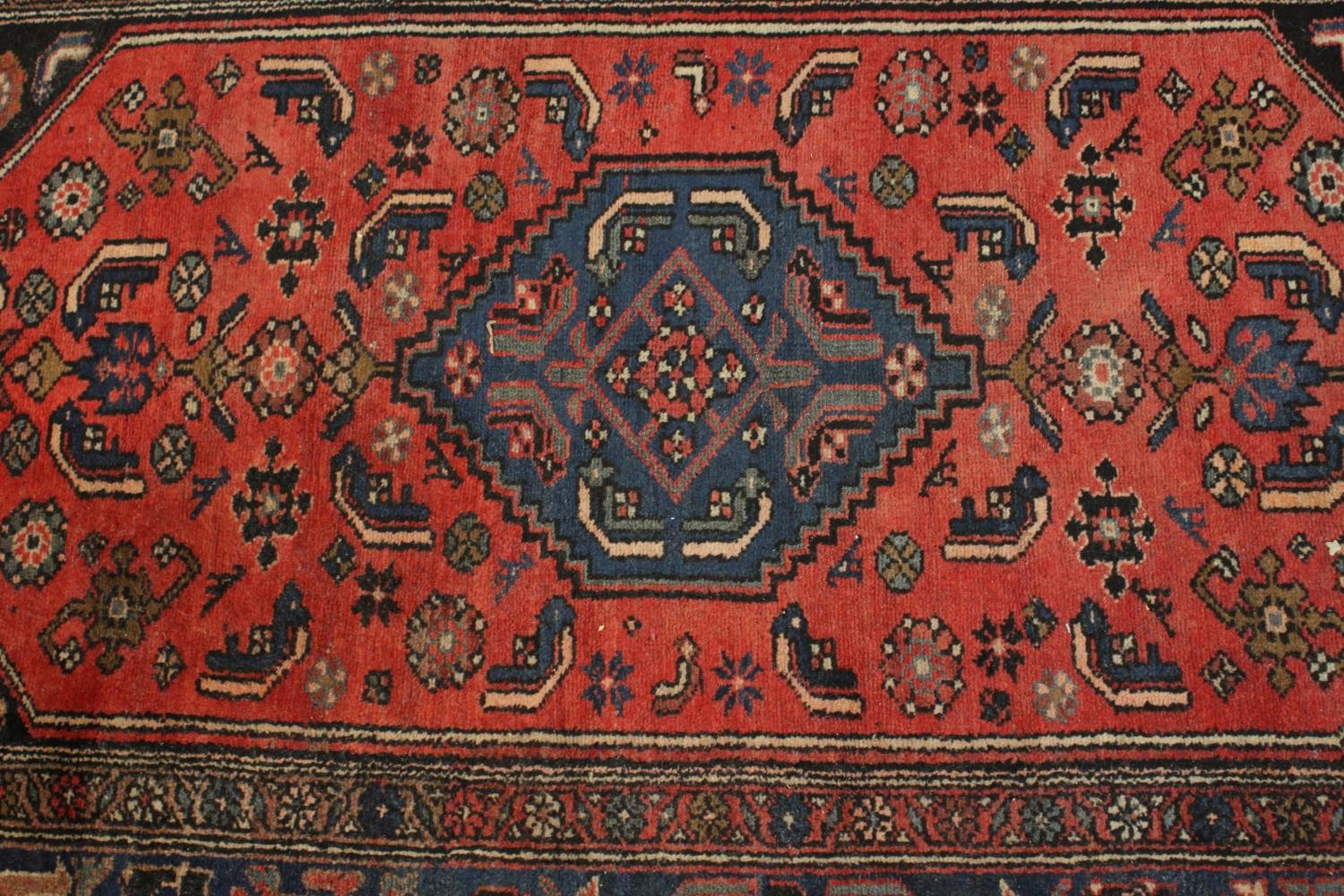 A hand made red ground Persian Hamadan carpet. L.210 W.129cm. - Image 3 of 5