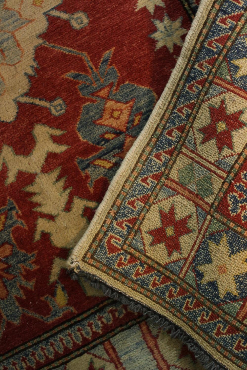 A hand made red ground Chechen Kazak rug. L.150 W.115cm. - Image 6 of 6