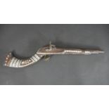 A 19th century Indian percussion musket, the butt and stock decorated with mother of pearl and
