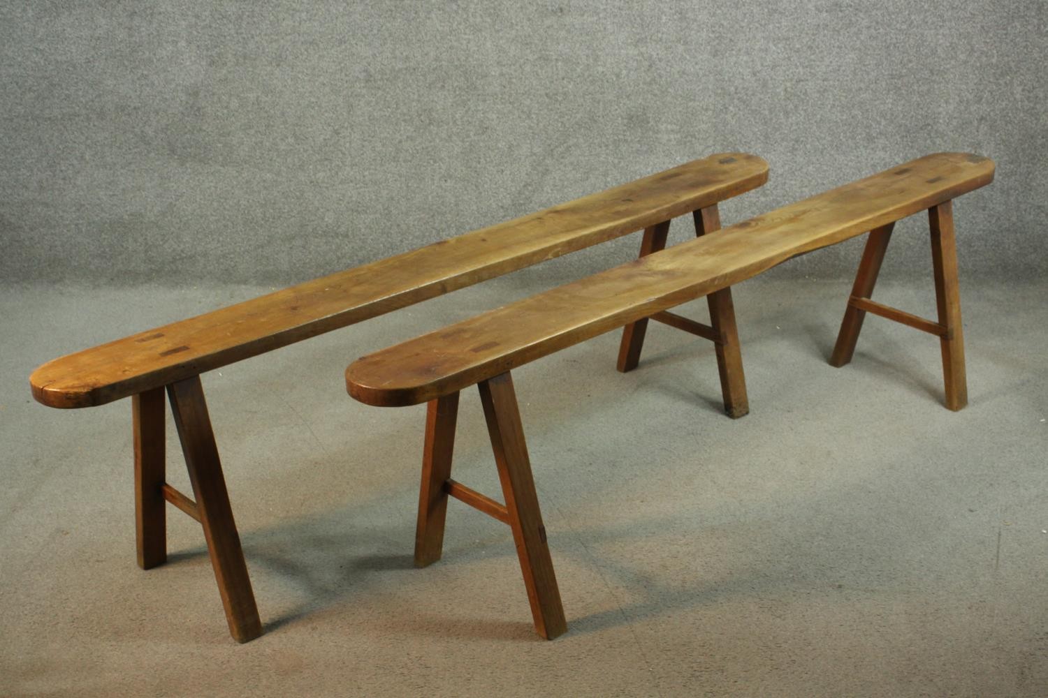 A pair of 19th century French provincial oak benches, the plank tops with rounded ends, on splayed - Image 3 of 8
