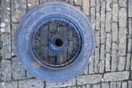 A vintage Bentley steel wire spoked painted wheel with a Leicester Tyre Co. tyre, size 7.00-21.(This