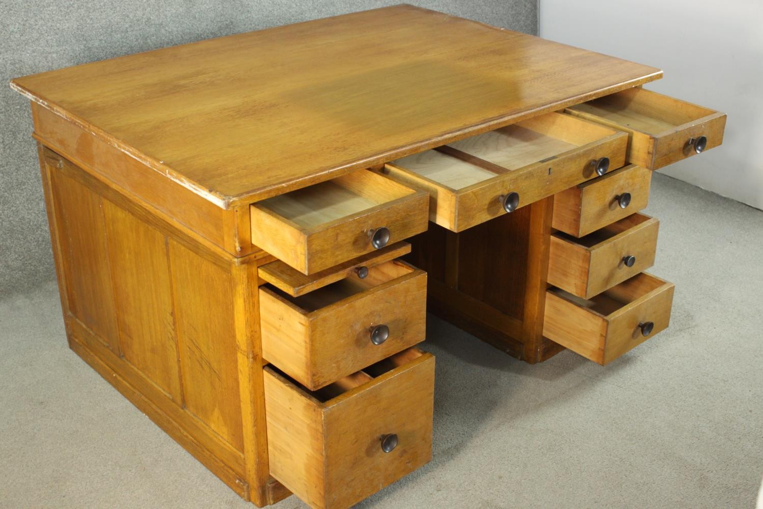 An early to mid 20th century oak pedestal desk, with three short drawers, over two slides, above two - Image 7 of 9