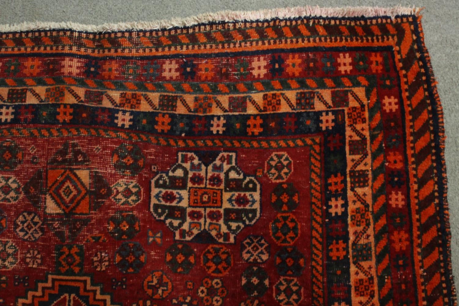 A hand made red ground Persian Qashqai carpet. L.236 W.155cm. - Image 4 of 6