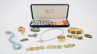 A collection of costume jewellery, including a silver and marcasite bear brooch, damascene bracelets