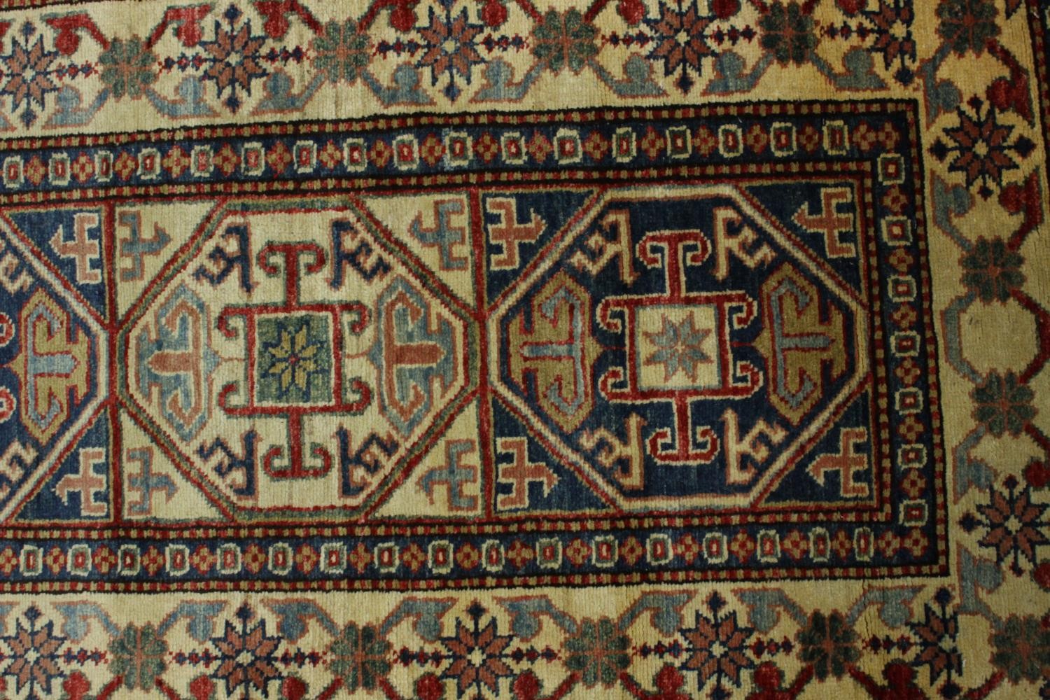 A hand made blue ground Chechen carpet. L.260 W.74cm. - Image 3 of 7