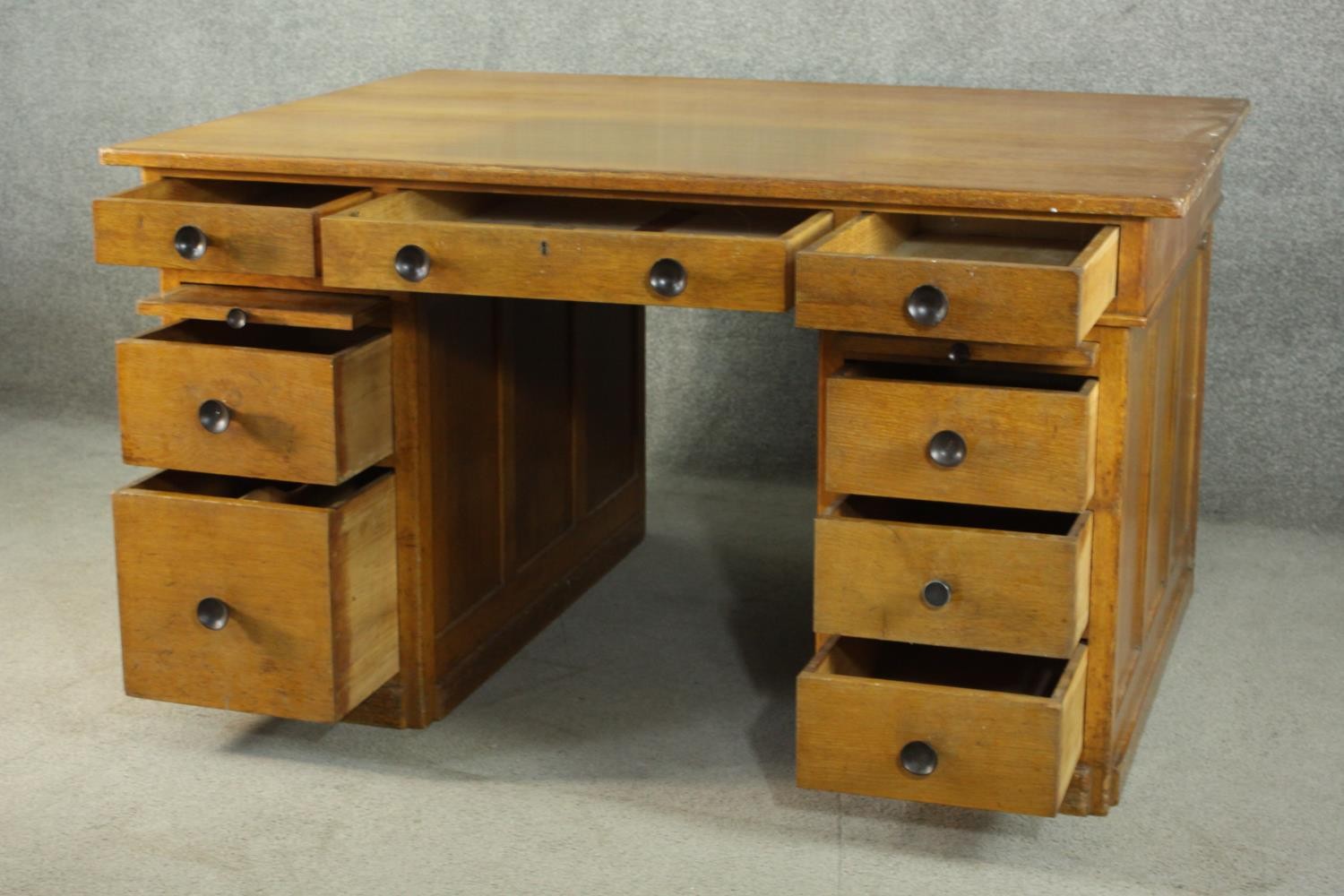 An early to mid 20th century oak pedestal desk, with three short drawers, over two slides, above two - Image 5 of 9