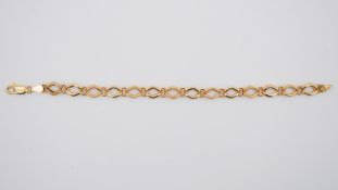 A 9 ct yellow gold fancy link bracelet, the diamond shaped links are textured and it fastens with