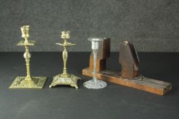 Two Victorian repousse foliate design brass candle sticks along with a pewter tree form candle stick