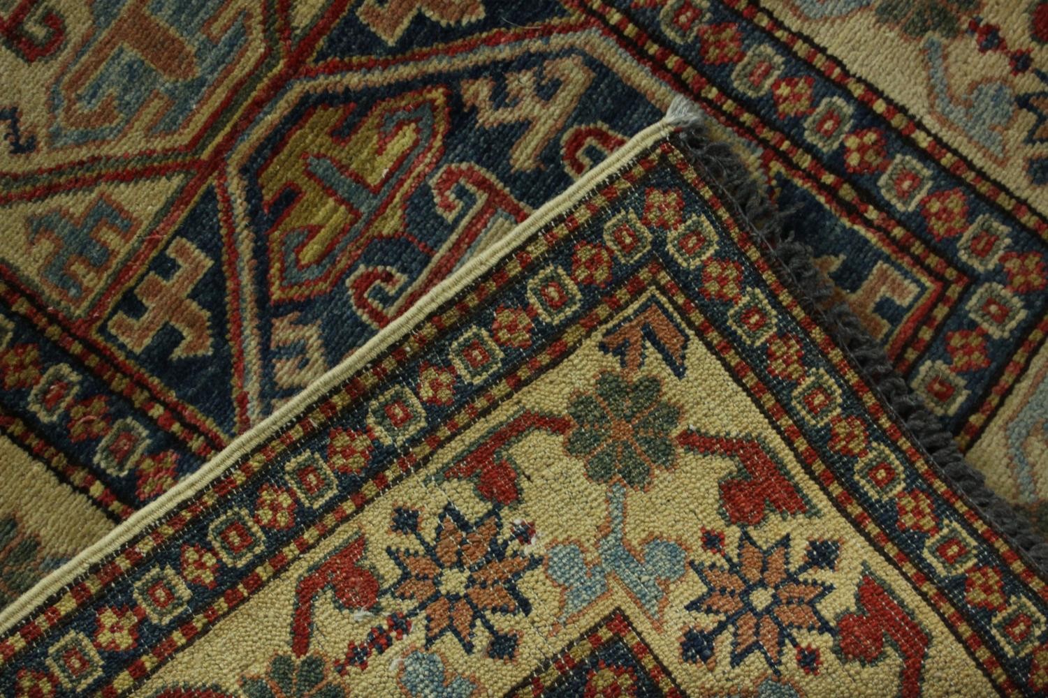 A hand made blue ground Chechen carpet. L.260 W.74cm. - Image 7 of 7