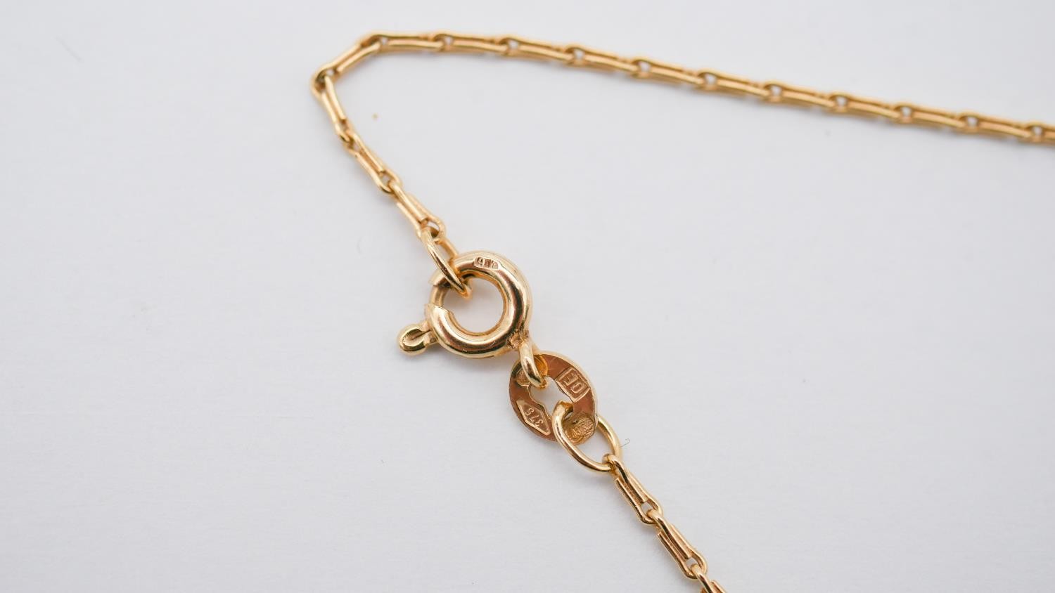 A diamond and sapphire stylised floral design pendant on a fine 9ct gold fancy link chain with C- - Image 6 of 8