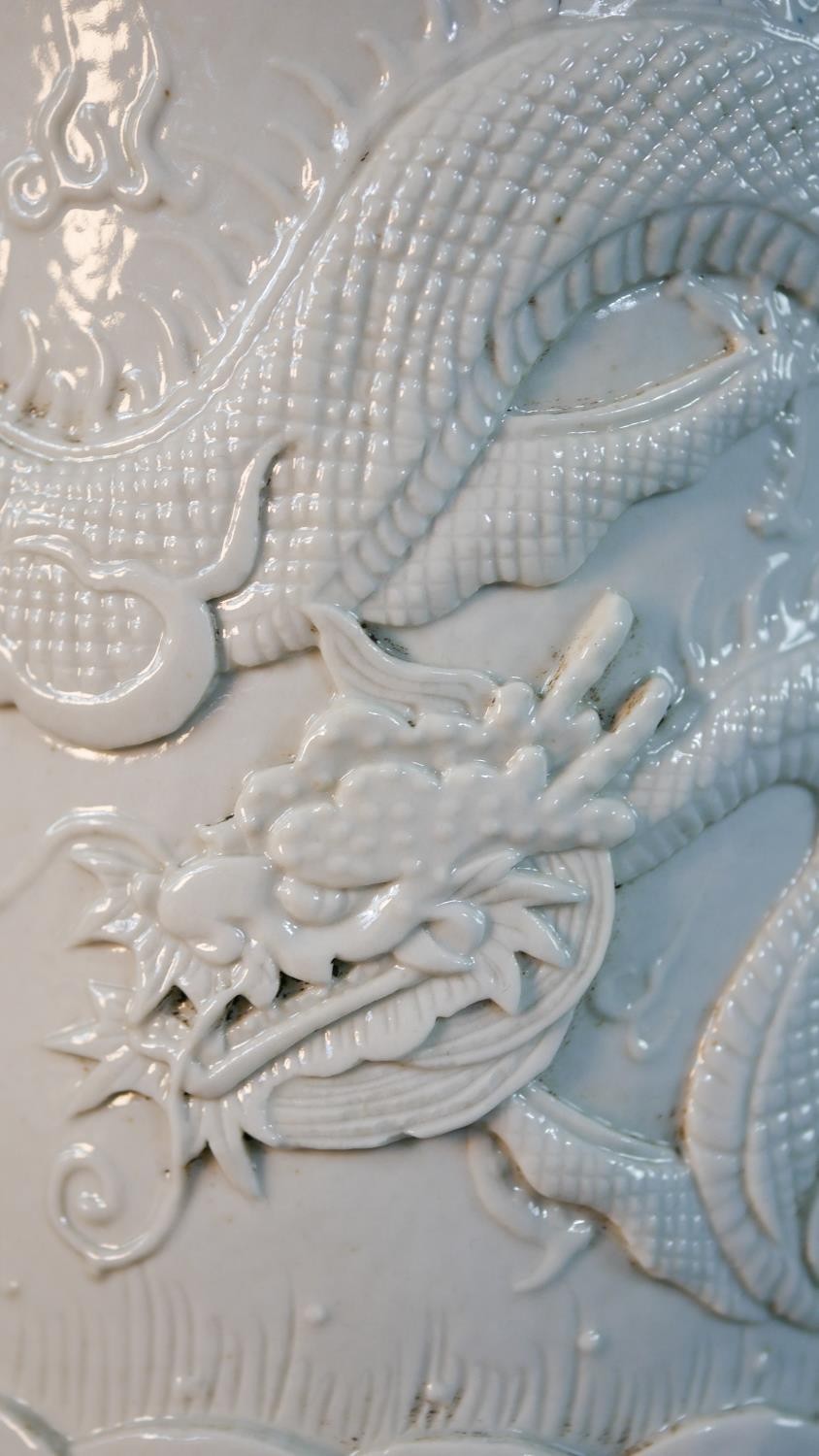 A Chinese blanc de chine relief porcelain dragon among the waves design brush pot. Impressed - Image 4 of 9