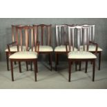 A set of six G-Plan stained beech dining chairs, including two carvers and four side chairs, the
