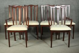 A set of six G-Plan stained beech dining chairs, including two carvers and four side chairs, the