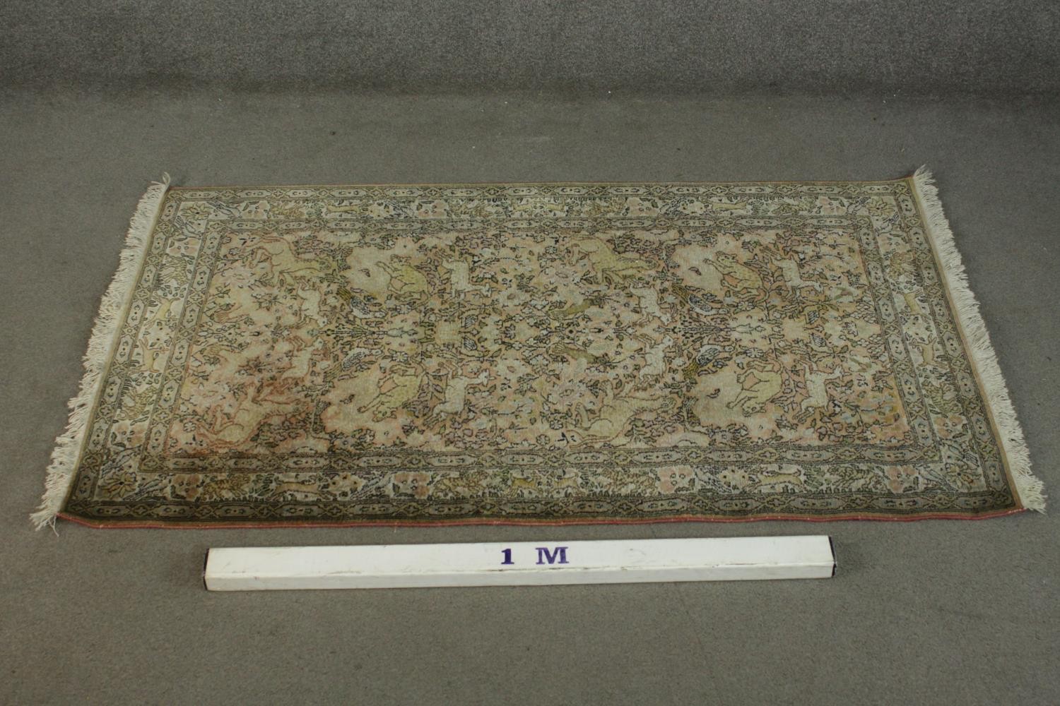 A hand made beige ground silk Kashmir Persian rug. L.160 W.95cm. - Image 2 of 5