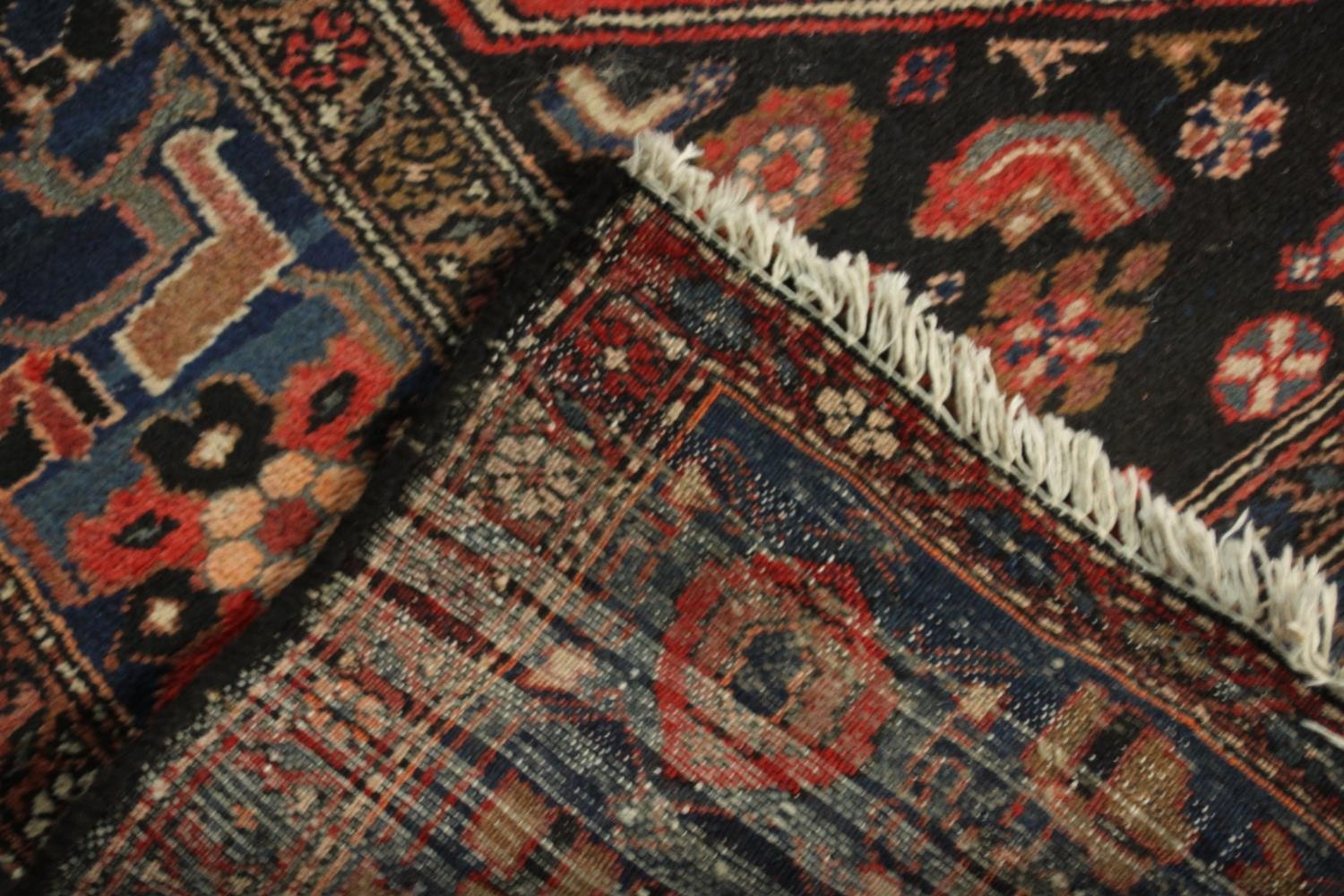 A hand made red ground Persian Hamadan carpet. L.210 W.129cm. - Image 5 of 5