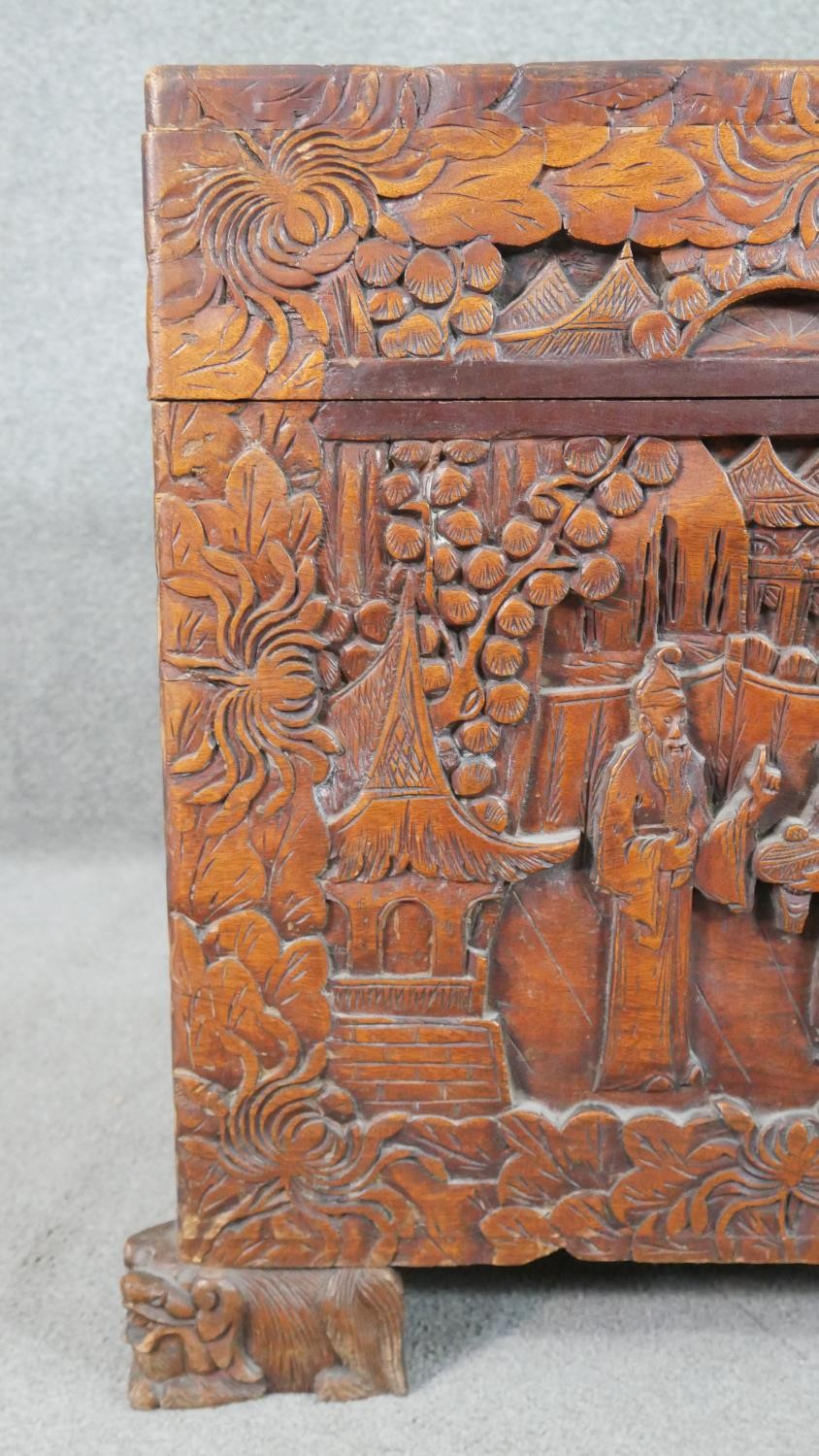 A 20th century Chinese camphorwood coffer, of rectangular form, the lid and sides ornately carved - Image 4 of 9