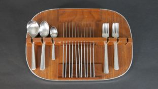 A vintage six person part Elkington brushed chrome cutlery set on teak and chrome wall mounted