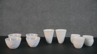 Four Lene Bjerre ceramic sake cups with grey glaze to the inside, three abstract design sake cups