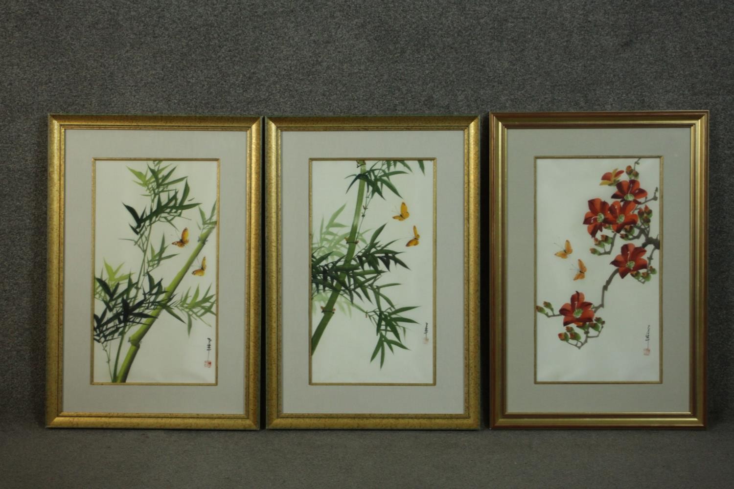 Three framed and glazed Chinese inks on silk depicting flowers, foliage and insects. Each with