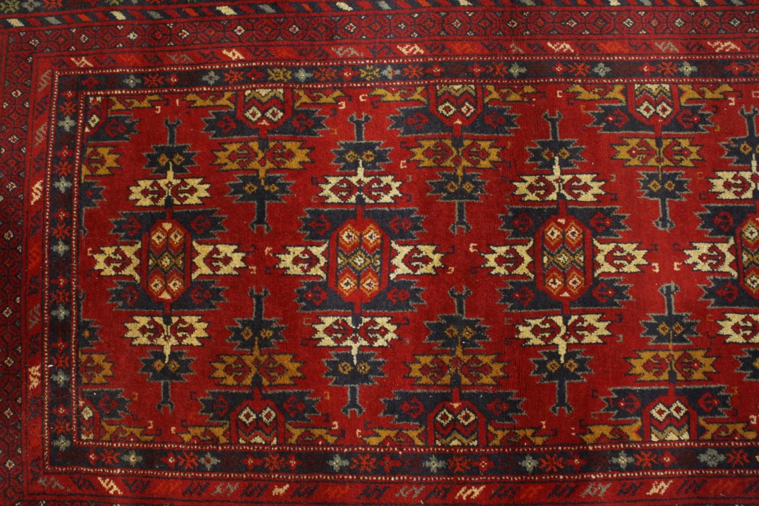 A hand made red ground Ankhoi Afghan rug. L.150 W.87cm. - Image 3 of 5