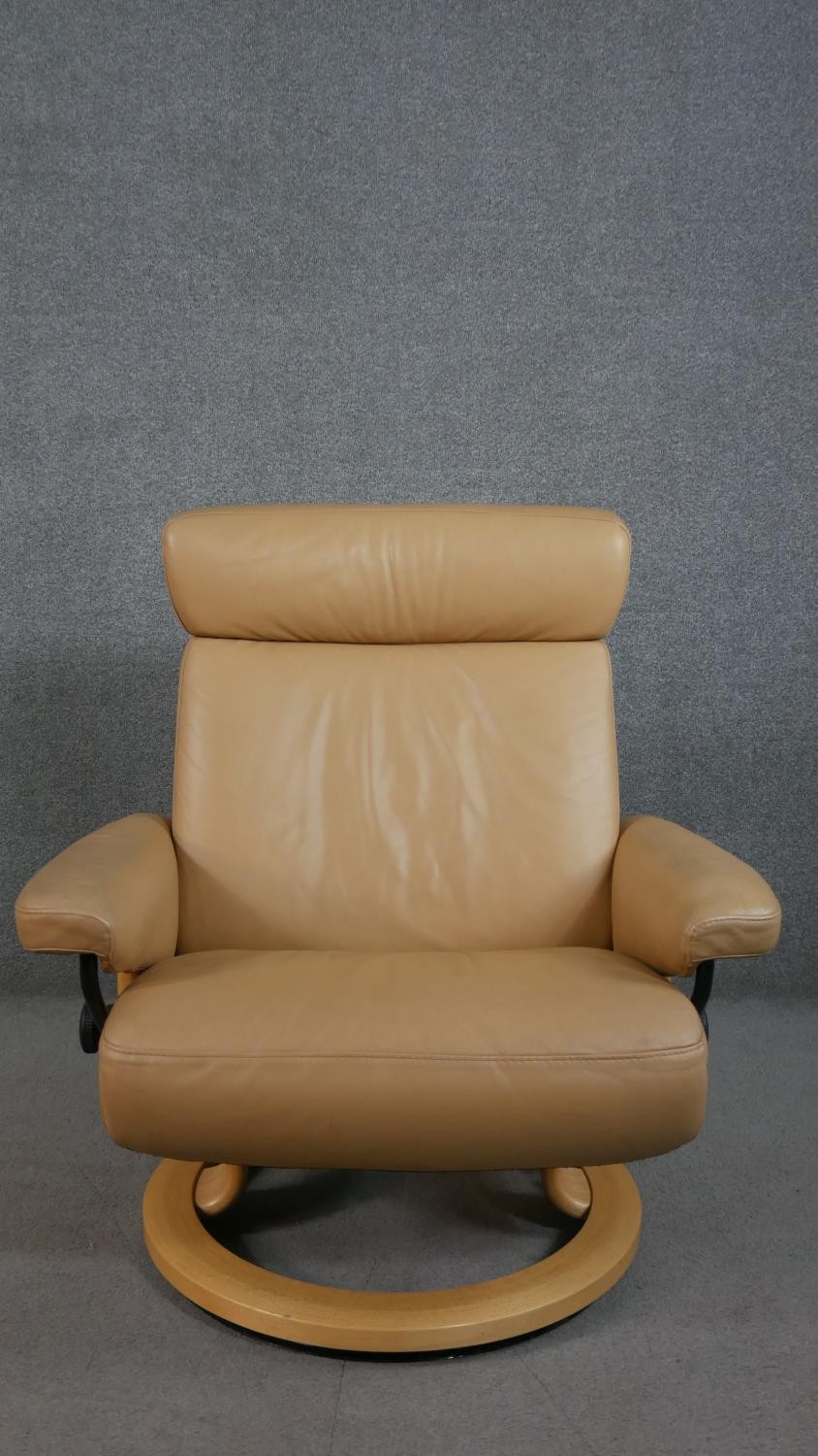 A Norwegian Ekornes Stressless chair & stool, upholstered in tan leather, with a beech frame, on - Image 2 of 11