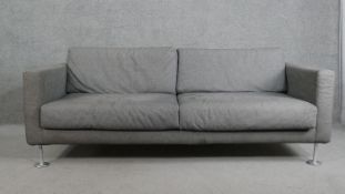Jasper Morrison for Vitra, a grey wool upholstered two seater sofa, on cylindrical tubular chromed