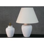 Two white ceramic ridged swirl design table lamps. H.29 (largest)