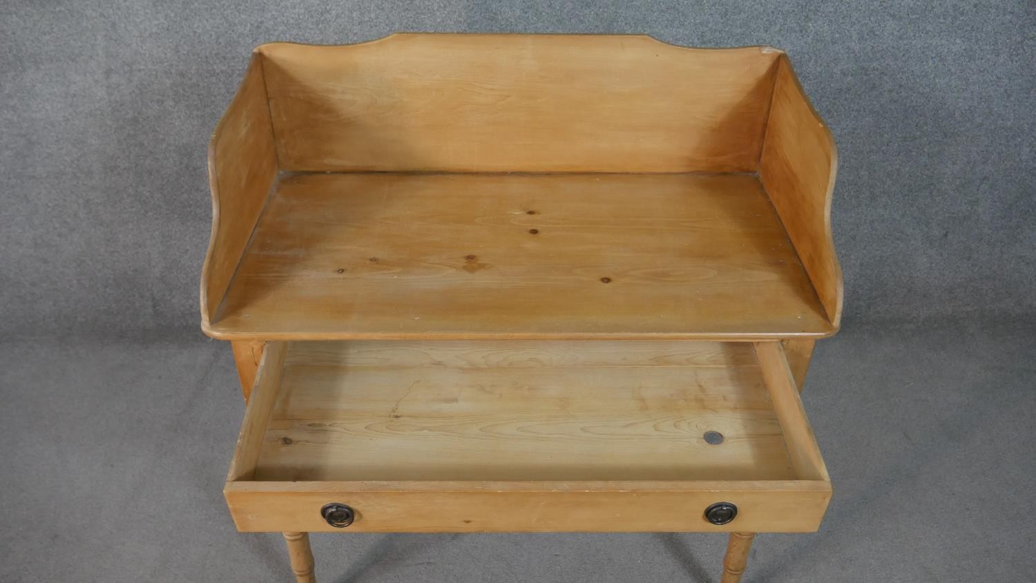 A Victorian pine washstand with raised back and frieze drawer on tapering turned supports. H.47 W.90 - Image 4 of 8