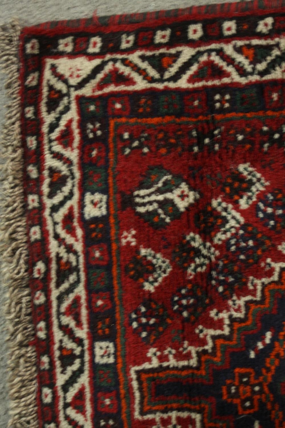 A hand made red ground Shiraz rug. L.130 W.82cm. - Image 6 of 6