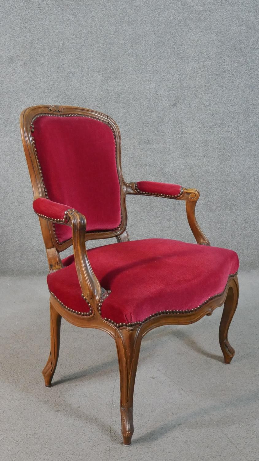 A pair of French walnut Louis XV style fauteuil armchairs, upholstered in red fabric to the back, - Image 7 of 7
