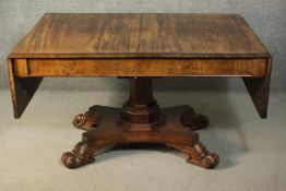 An early Victorian mahogany library table, the rectangular top with two drop leaves, on an