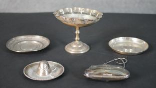 A collection of silver and silver plate, including a silver miniature sombrero, two white metal