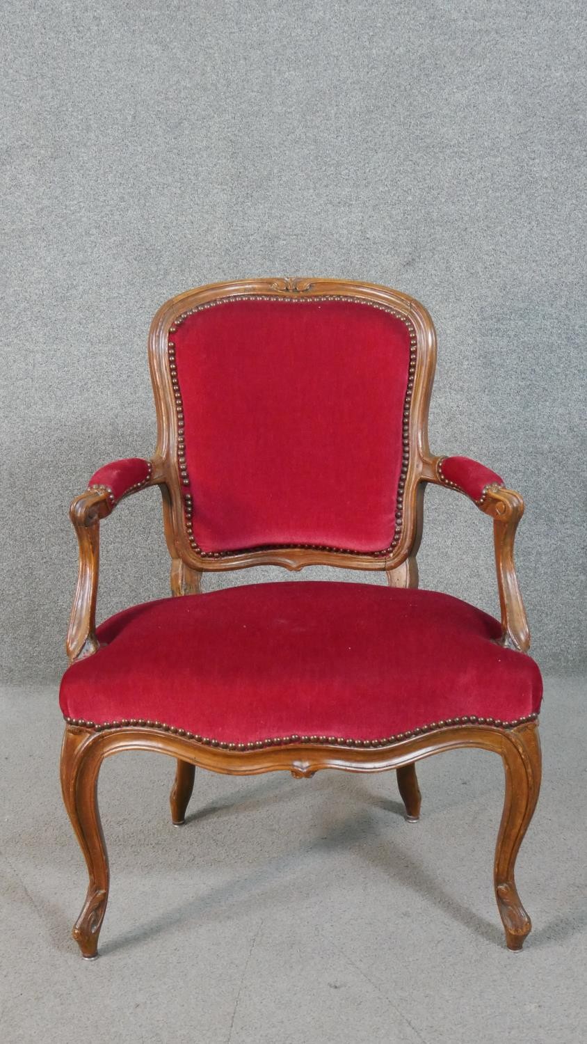 A pair of French walnut Louis XV style fauteuil armchairs, upholstered in red fabric to the back, - Image 2 of 7