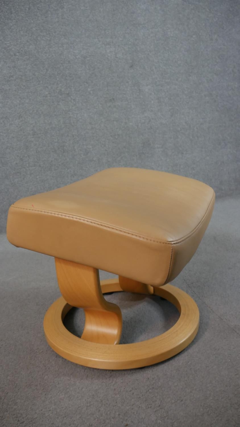 A Norwegian Ekornes Stressless chair & stool, upholstered in tan leather, with a beech frame, on - Image 10 of 11