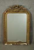 A 19th century gilt French mirror, the rectangular bevelled plate with curved top corners, beaded