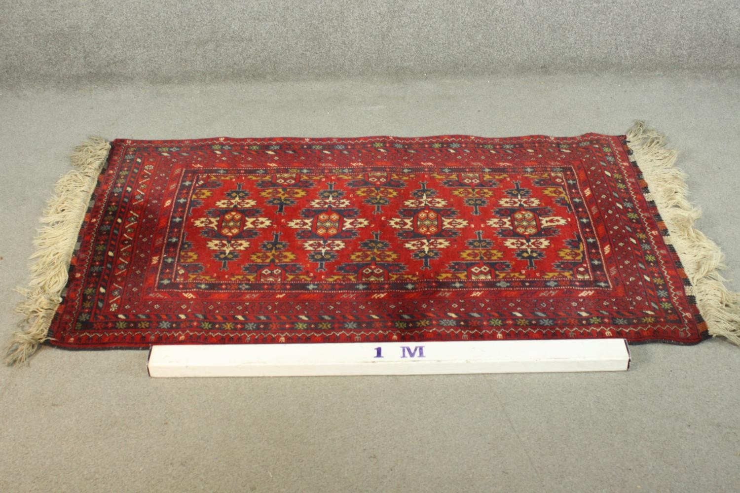 A hand made red ground Ankhoi Afghan rug. L.150 W.87cm. - Image 2 of 5