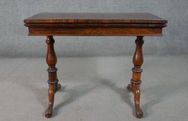 A mid Victorian rosewood fold over top card table on cabriole pad foot supports. H.71 W.101 D.