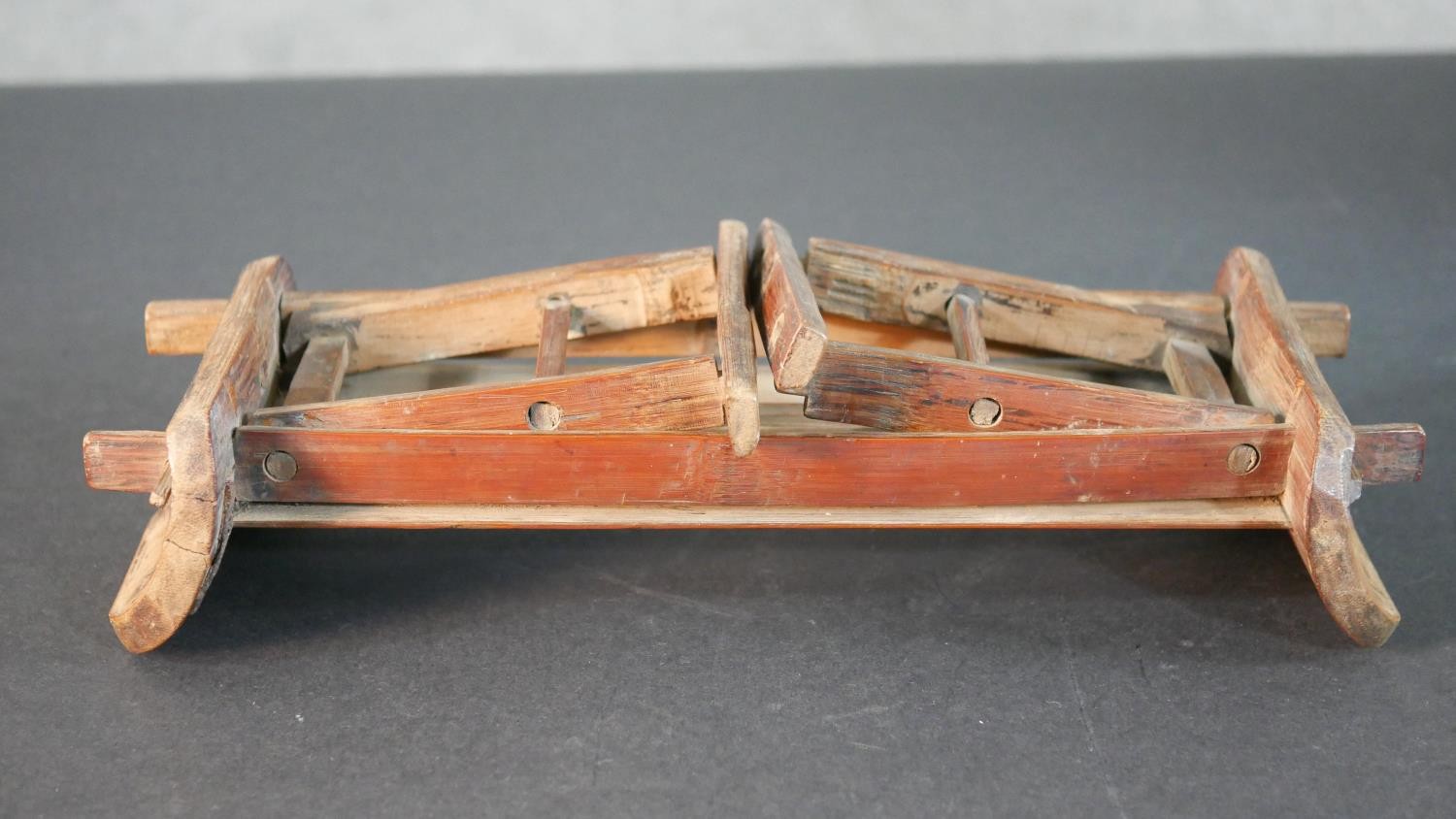 A 19th century Chinese bamboo folding travel head rest along with a carved plate inlaid with a - Image 6 of 10