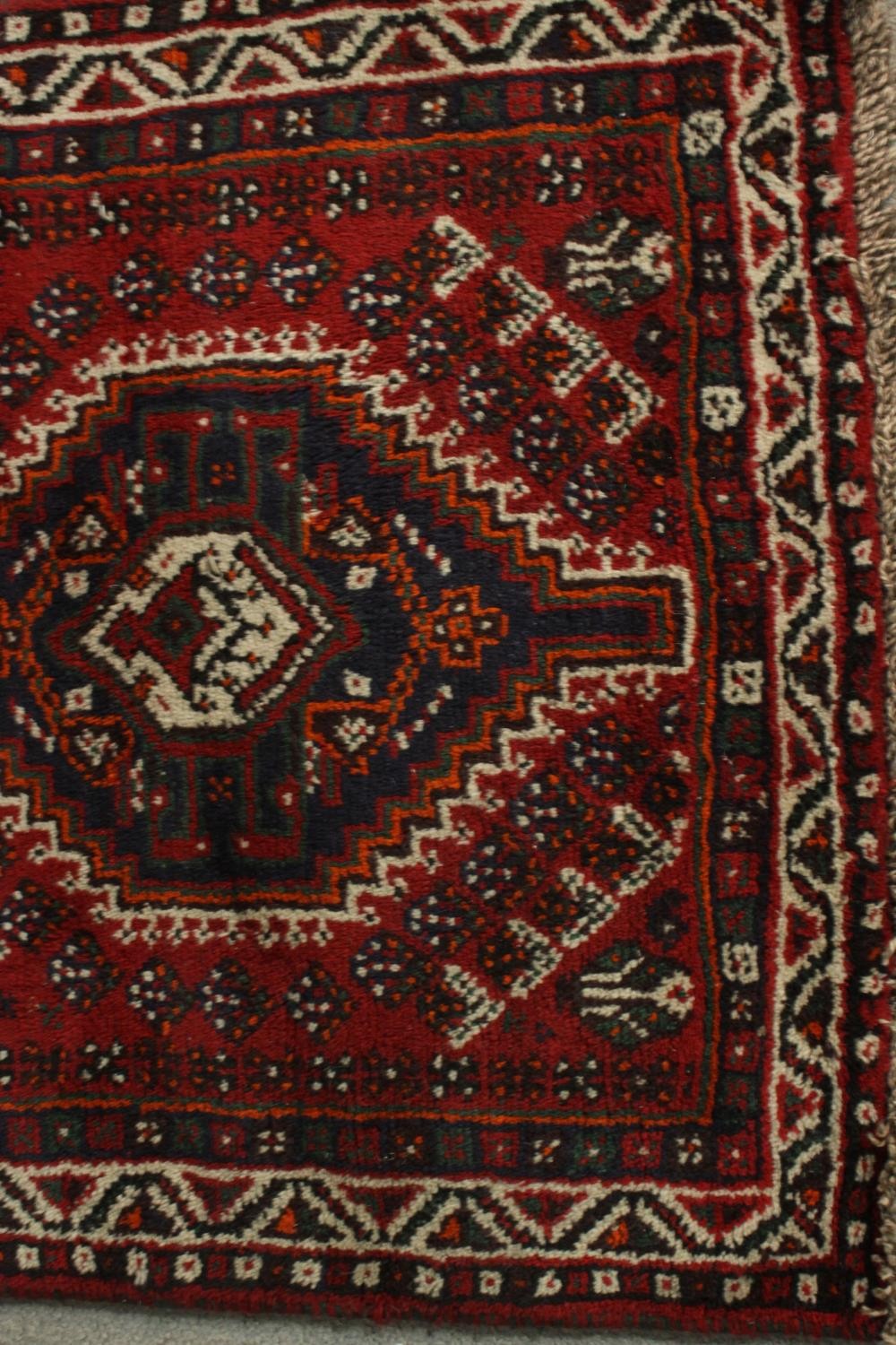 A hand made red ground Shiraz rug. L.130 W.82cm. - Image 4 of 6