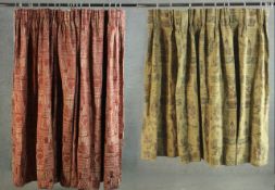 Two fully lined silk mix curtains one with medieval castle and lettering design and one red ground