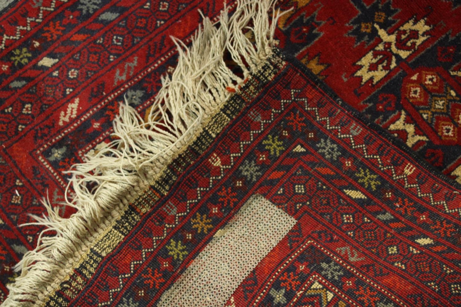 A hand made red ground Ankhoi Afghan rug. L.150 W.87cm. - Image 5 of 5