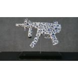 After Diederik van Apple 1985, resin automatic gun painted with a blue and white Delft pattern. H.35