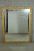 A contemporary gilt framed mirror, of rectangular form, with a bevelled mirror plate, the frame with