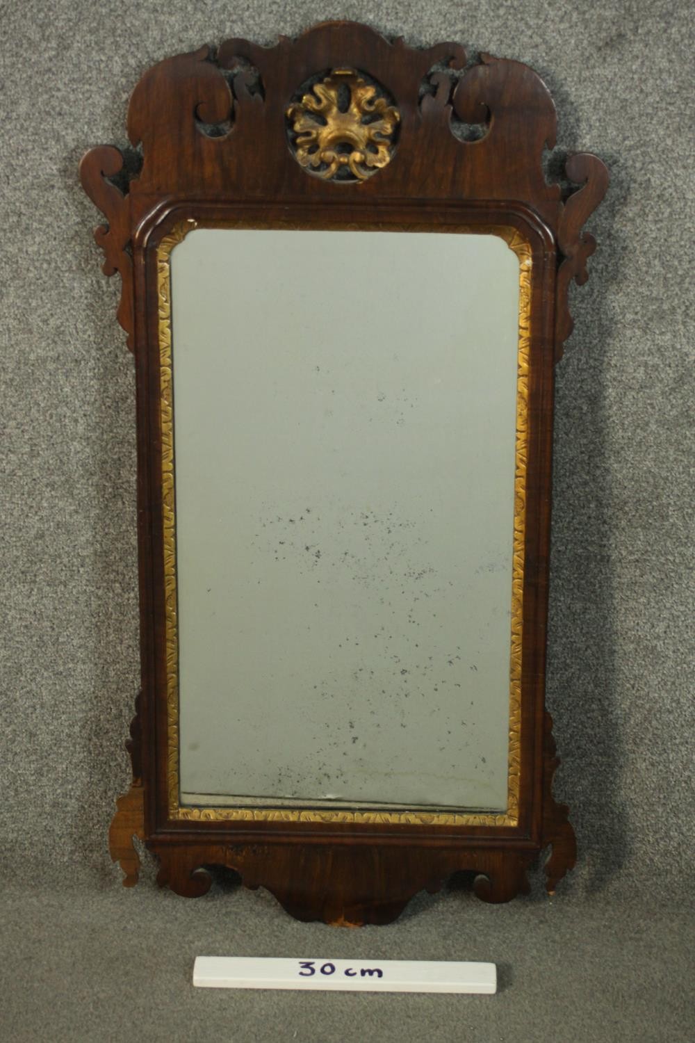 A George III parcel gilt mahogany fretwork mirror, with a carved and pierced stylised leaf over a - Image 2 of 5